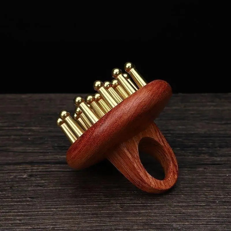 Peine de masaje de madera y cobre